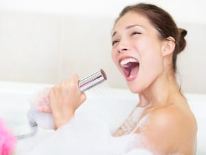 woman singing in bath shower