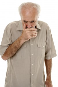 Senior man coughing