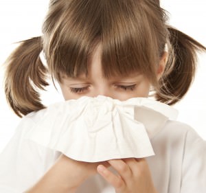 ill little girl with handkerchief